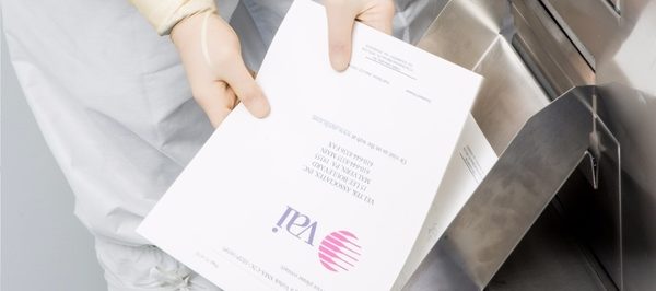 sterile lint-free white cleanroom paper being used in a copier