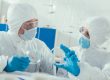 wearing cleanroom gloves to prevent exposure