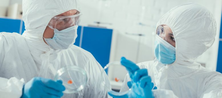 wearing cleanroom gloves to prevent exposure