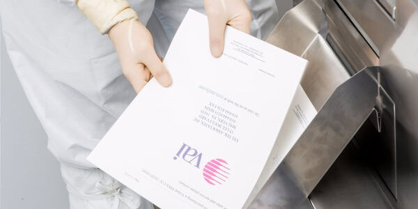 sterile lint-free white cleanroom paper being used in a copier