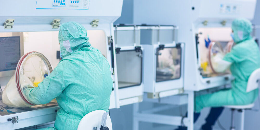 pharmaceutical technician in sterile environment working on prod