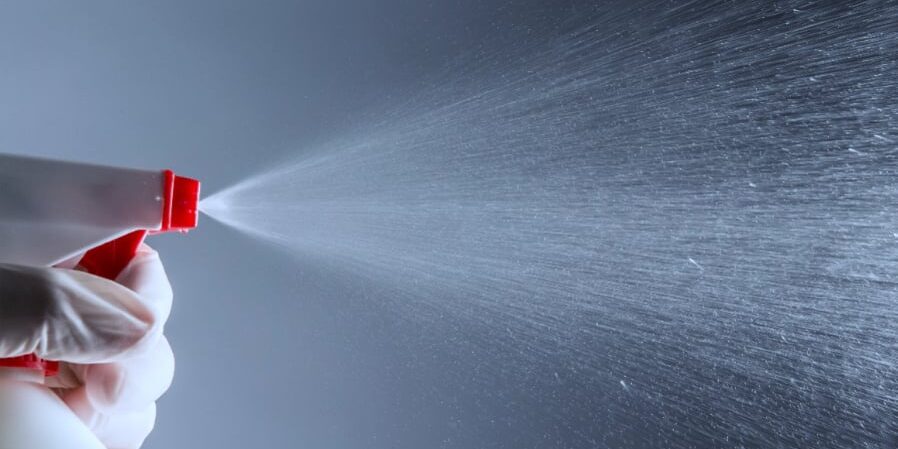 hydrogen peroxide sprayed from spray bottle in cleanroom